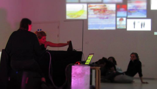 Performance image of Lisa Hall and Hannah Kemp Welch performing in a gallery